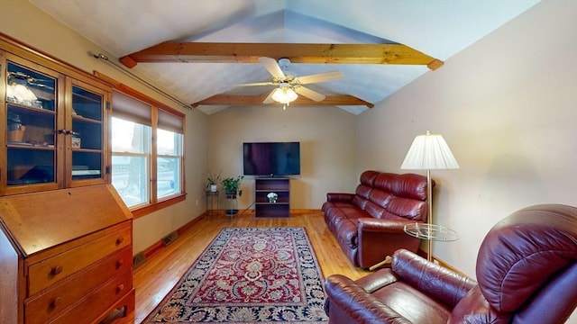 living room with lofted ceiling with beams, light wood finished floors, visible vents, and a ceiling fan