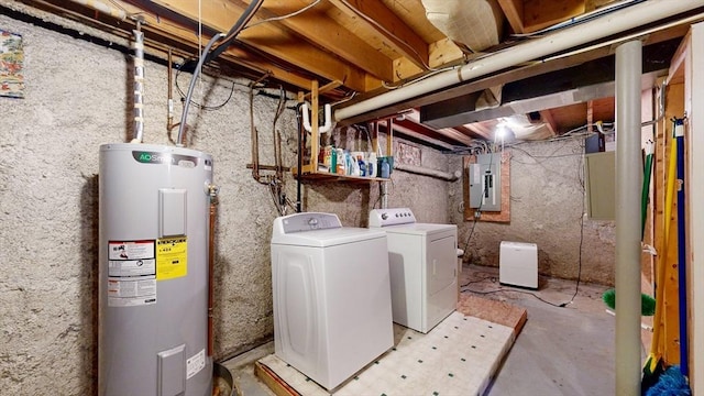 clothes washing area featuring independent washer and dryer, laundry area, water heater, and electric panel