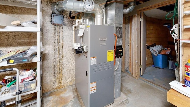 utility room featuring heating unit