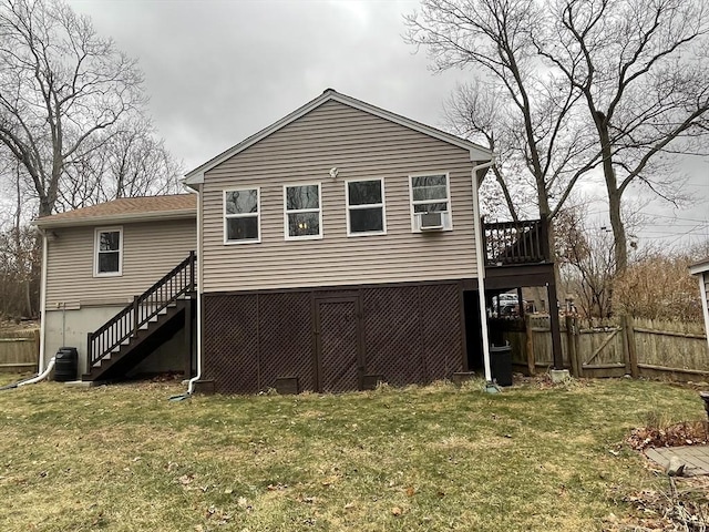 back of property with a lawn, stairway, fence, cooling unit, and a wooden deck