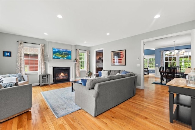 6 Jacoby Way, Seekonk, MA 02771 - living area with light wood-style flooring, a fireplace with flush hearth, and recessed lighting