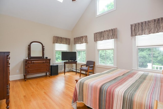 37 Pemberton Rd, Wayland, MA 01778 - bedroom featuring high vaulted ceiling, light wood-type flooring, and a baseboard heating unit