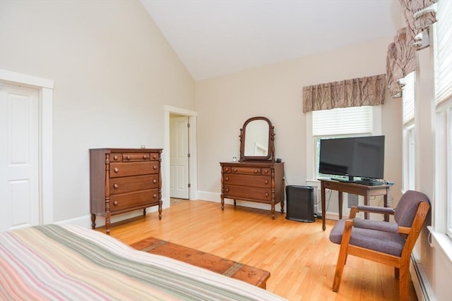 37 Pemberton Rd, Wayland, MA 01778 - bedroom with high vaulted ceiling, baseboard heating, and light wood-style floors