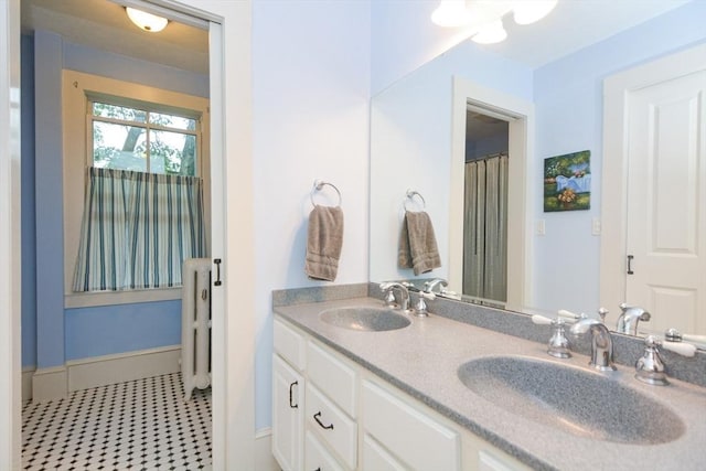 37 Pemberton Rd, Wayland, MA 01778 - full bathroom with double vanity and radiator heating unit