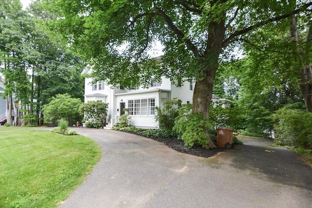 37 Pemberton Rd, Wayland, MA 01778 - obstructed view of property featuring a front yard and asphalt driveway
