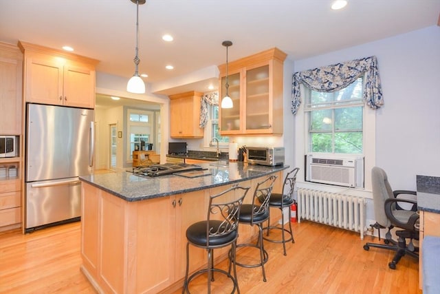 37 Pemberton Rd, Wayland, MA 01778 - kitchen with stainless steel appliances, radiator heating unit, light wood-style flooring, cooling unit, and light brown cabinetry
