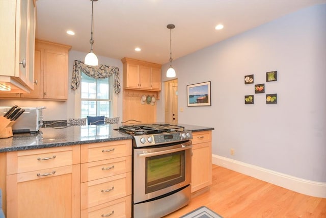 37 Pemberton Rd, Wayland, MA 01778 - kitchen with stainless steel gas range oven, light brown cabinetry, light wood-style floors, hanging light fixtures, and recessed lighting