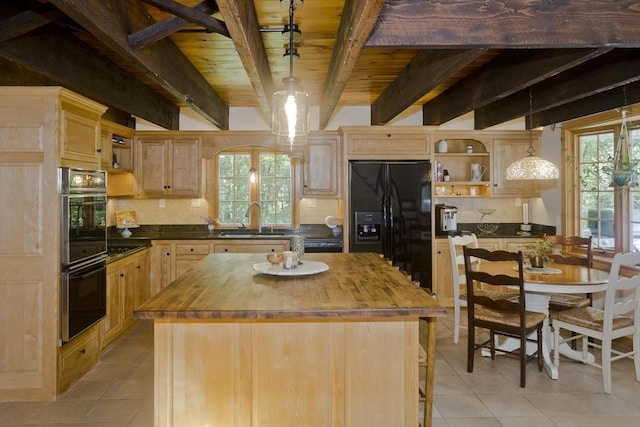 60 Daniel Shays Hwy, Pelham, MA 01002 - kitchen with wooden counters, black refrigerator with ice dispenser, stainless steel double oven, light tile patterned floors, and decorative backsplash