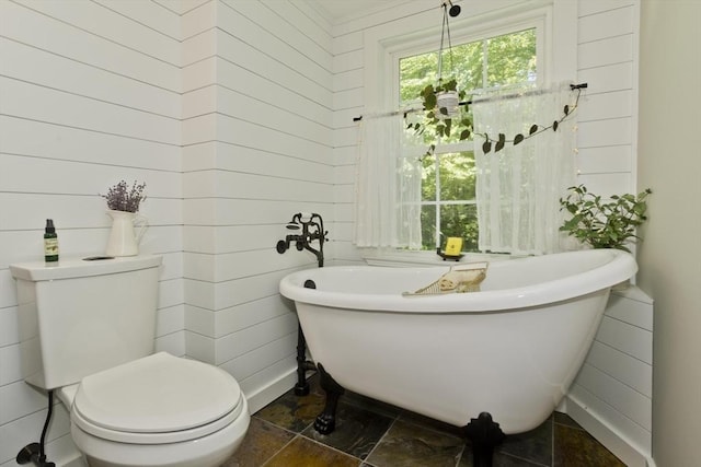 60 Daniel Shays Hwy, Pelham, MA 01002 - full bathroom featuring a freestanding tub, stone finish flooring, and wooden walls