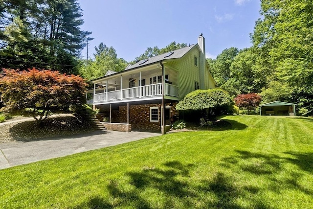 60 Daniel Shays Hwy, Pelham, MA 01002 - back of house with a yard, a chimney, a ceiling fan, stairway, and a detached carport