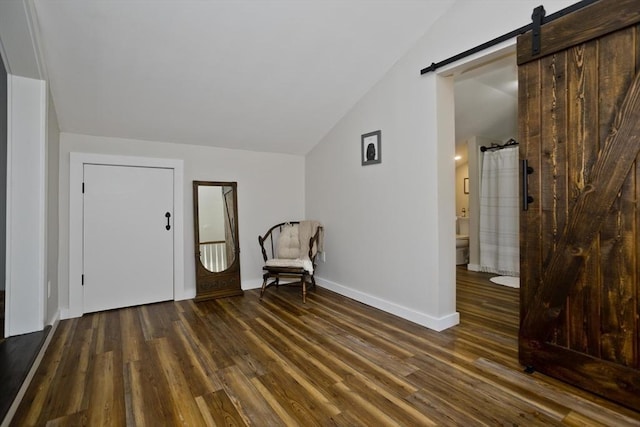 60 Daniel Shays Hwy, Pelham, MA 01002 - unfurnished room with lofted ceiling, dark wood finished floors, and a barn door