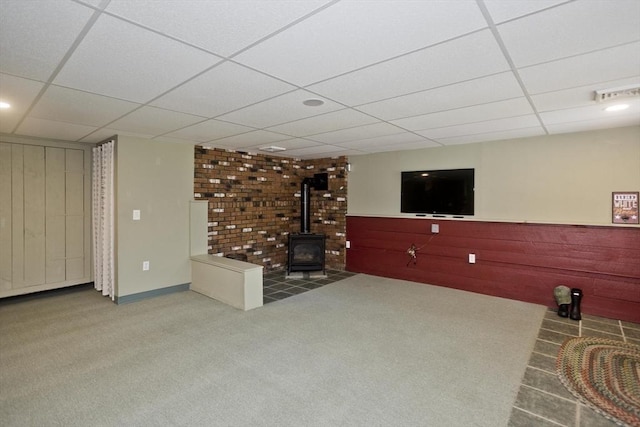 60 Daniel Shays Hwy, Pelham, MA 01002 - unfurnished living room with a drop ceiling, carpet floors, and a wood stove