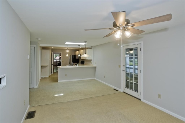 60 Daniel Shays Hwy, Pelham, MA 01002 - unfurnished living room with light carpet and ceiling fan