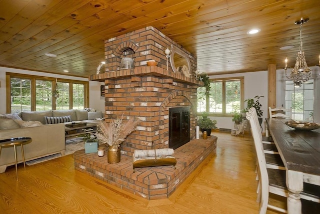 60 Daniel Shays Hwy, Pelham, MA 01002 - living area featuring wood ceiling, a chandelier, a brick fireplace, light wood finished floors, and recessed lighting