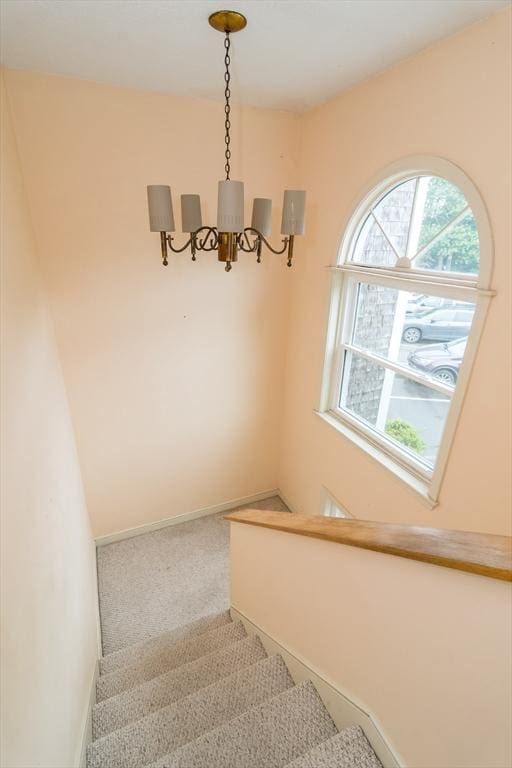 17 Harbor Hl Unit 17, Bourne, MA 02532 - staircase with a chandelier and carpet floors