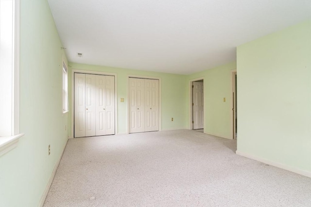 17 Harbor Hl Unit 17, Bourne, MA 02532 - unfurnished bedroom with multiple closets and light carpet