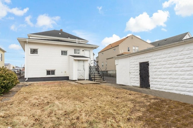 rear view of house featuring stairway