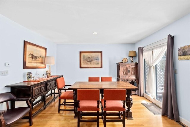 dining area featuring recessed lighting and light wood finished floors