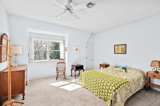 bedroom with carpet floors, baseboards, a ceiling fan, and visible vents