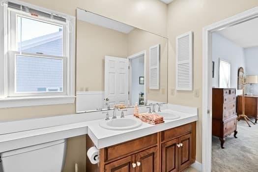 bathroom featuring double vanity and a sink