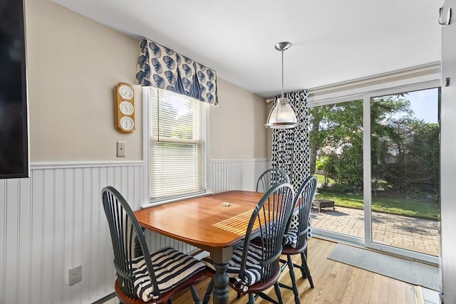 28 Chestnut St, Falmouth, MA 02536 - dining area featuring wainscoting, plenty of natural light, and wood finished floors