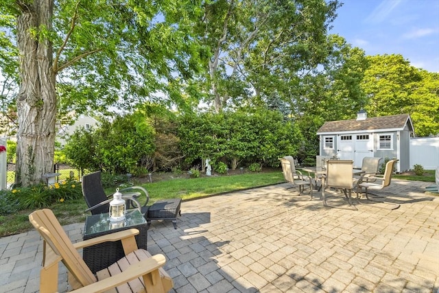 28 Chestnut St, Falmouth, MA 02536 - view of patio / terrace with outdoor dining space and a storage shed