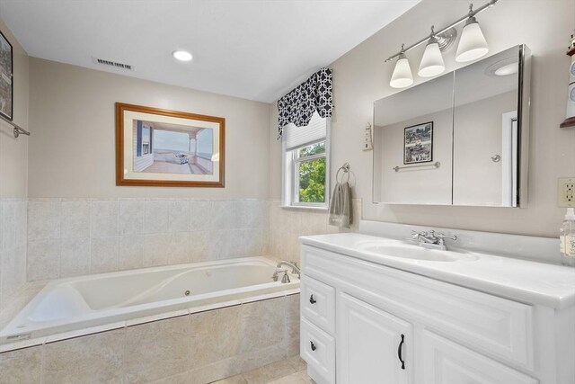 28 Chestnut St, Falmouth, MA 02536 - full bath featuring vanity, a tub with jets, tile patterned flooring, and recessed lighting
