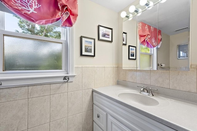 28 Chestnut St, Falmouth, MA 02536 - bathroom with vanity and tile walls