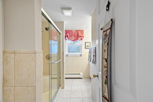 28 Chestnut St, Falmouth, MA 02536 - bathroom featuring baseboard heating, a shower stall, tile walls, tile patterned floors, and a wainscoted wall