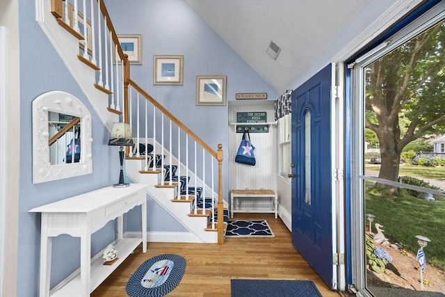 28 Chestnut St, Falmouth, MA 02536 - foyer with wood finished floors, stairway, and lofted ceiling