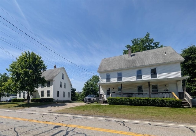 268-270 Providence Rd, Grafton, MA 01560 - view of front of property with covered porch, a front yard, a chimney, and driveway