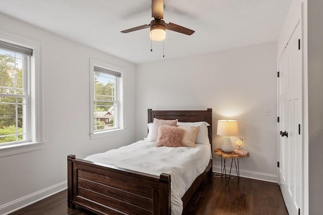 32 Gilman Rd, Billerica, MA 01862 - bedroom with multiple windows, dark wood finished floors, and baseboards
