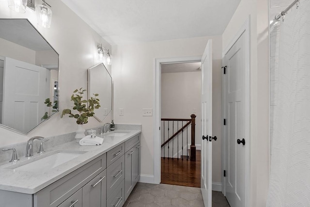 32 Gilman Rd, Billerica, MA 01862 - full bath featuring double vanity, tile patterned flooring, and baseboards