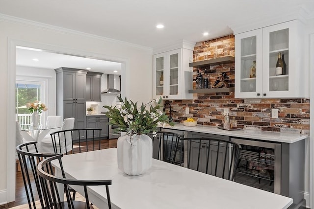 32 Gilman Rd, Billerica, MA 01862 - indoor bar featuring wall chimney range hood, beverage cooler, tasteful backsplash, dark wood finished floors, and recessed lighting