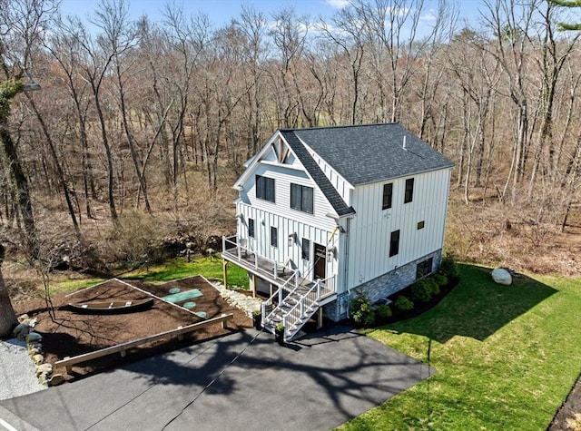 birds eye view of property with a view of trees