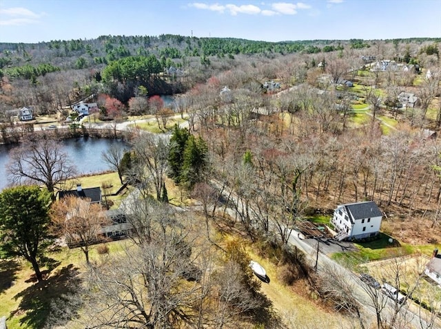 drone / aerial view with a water view and a wooded view