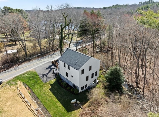 drone / aerial view with a view of trees
