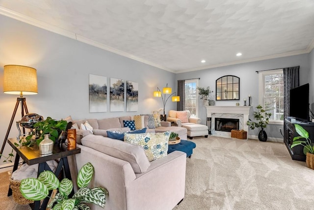 living room with recessed lighting, a fireplace, crown molding, carpet, and baseboards