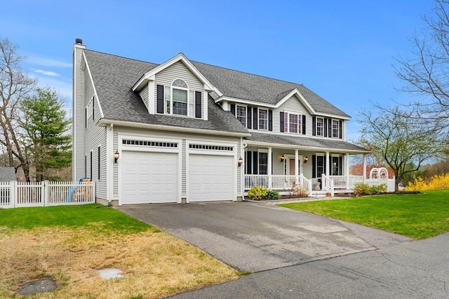 colonial house featuring a front yard, covered porch, aphalt driveway, a chimney, and fence