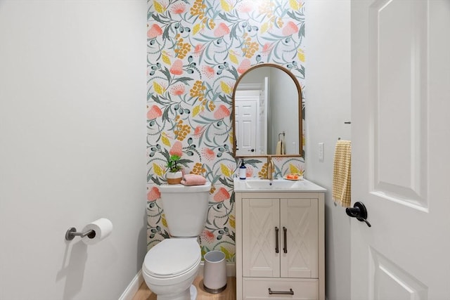 half bath with vanity and toilet