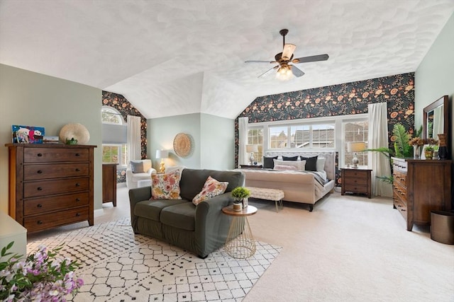 bedroom featuring a textured ceiling, ceiling fan, vaulted ceiling, and light carpet