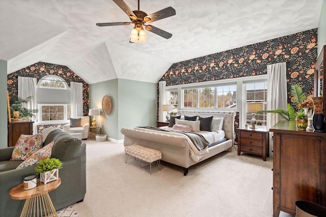 bedroom with ceiling fan, baseboards, vaulted ceiling, and carpet floors