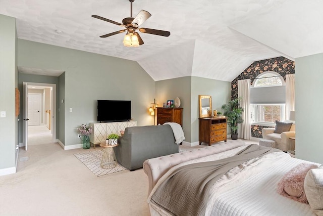 carpeted bedroom featuring baseboards, ceiling fan, and vaulted ceiling
