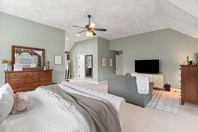 carpeted bedroom with lofted ceiling, ceiling fan, and baseboards