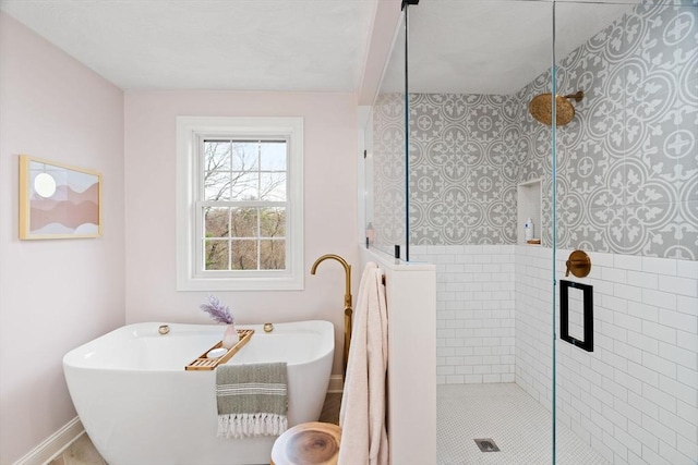 full bathroom featuring a shower stall and a soaking tub
