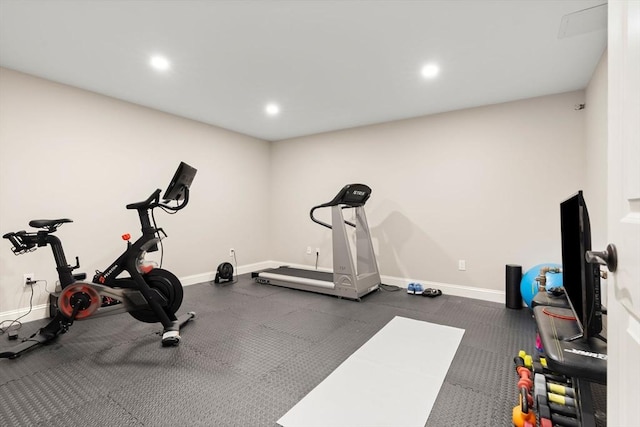 exercise room with recessed lighting and baseboards