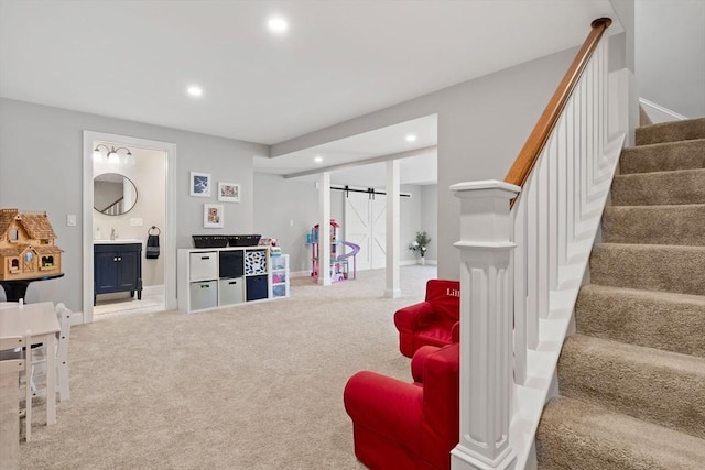 game room featuring baseboards, a barn door, carpet floors, and recessed lighting