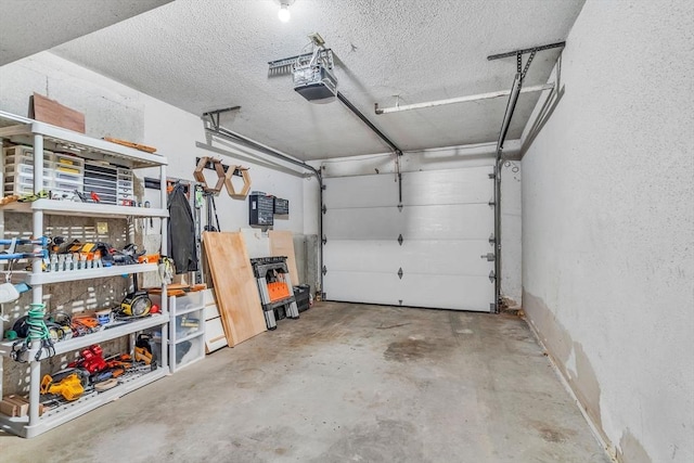 124 Tennis Plaza Rd Unit 2, Dracut, MA 01826 - garage featuring a garage door opener and a textured wall
