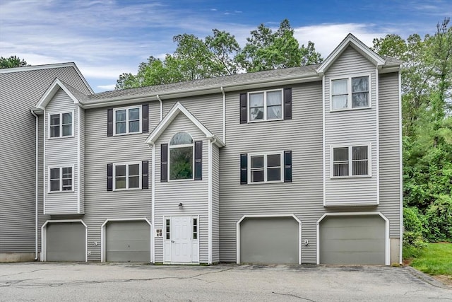 124 Tennis Plaza Rd Unit 2, Dracut, MA 01826 - view of front of house with an attached garage