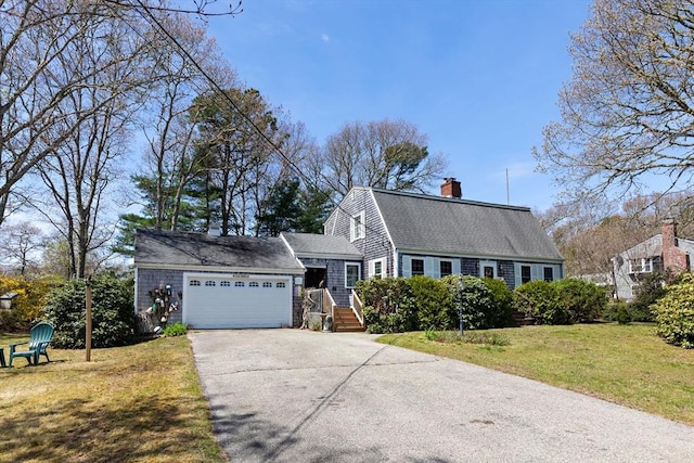 39 Bennets Neck Dr, Bourne, MA 02559 - colonial inspired home with asphalt driveway, an attached garage, a front lawn, a chimney, and a shingled roof